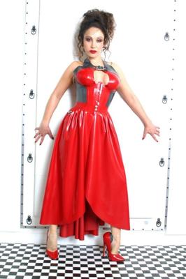 Jewel In A Red Latex Dress And Red High Heeled Pumps