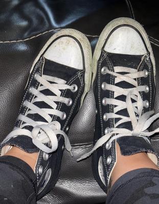 Ash removes her Chucks and sweaty socks