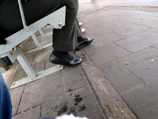 Damaged Black Socks with Tiny Man