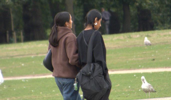 Attractive Indian girls walking.