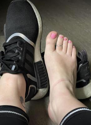 Ash removing black tennis shoes after the gym