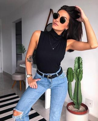 Black sleeveless tops and metal wristwatches #
