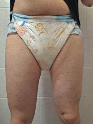 Messy diaper and diaper hood with diaper that\'s day old.