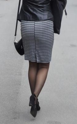 Business woman in midi skirt, pantyhose and suede heels