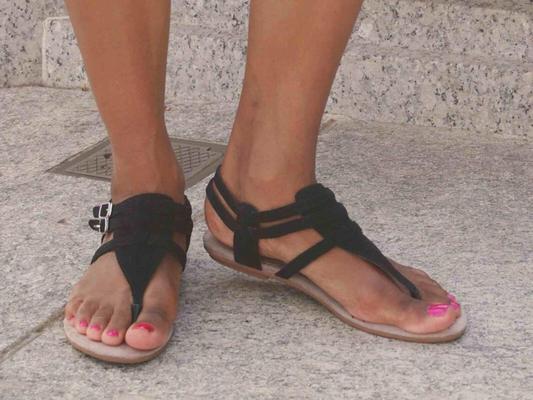 bare foot close ups with flat sandals 