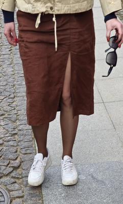 Girl in long skirt and brown pantyhose