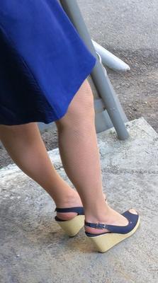 Co worker in fishnet pantyhose and wedges heels