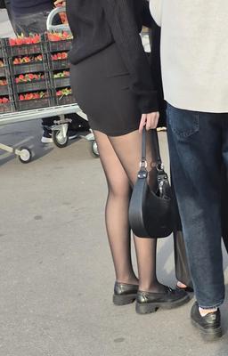 Girl in mini skirt and black pantyhose