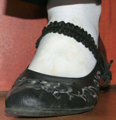legs in tights with traces of cum in the shoes