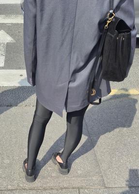 Girl in jacket and black leggins