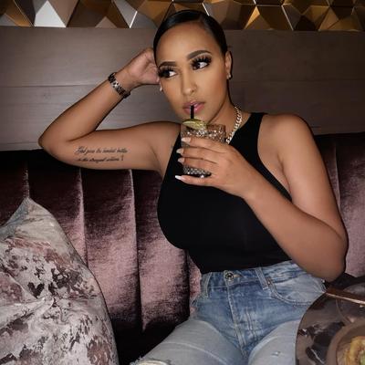 Black sleeveless tops and metal wristwatches #